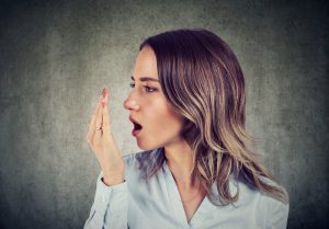 woman with bad breath does breath check